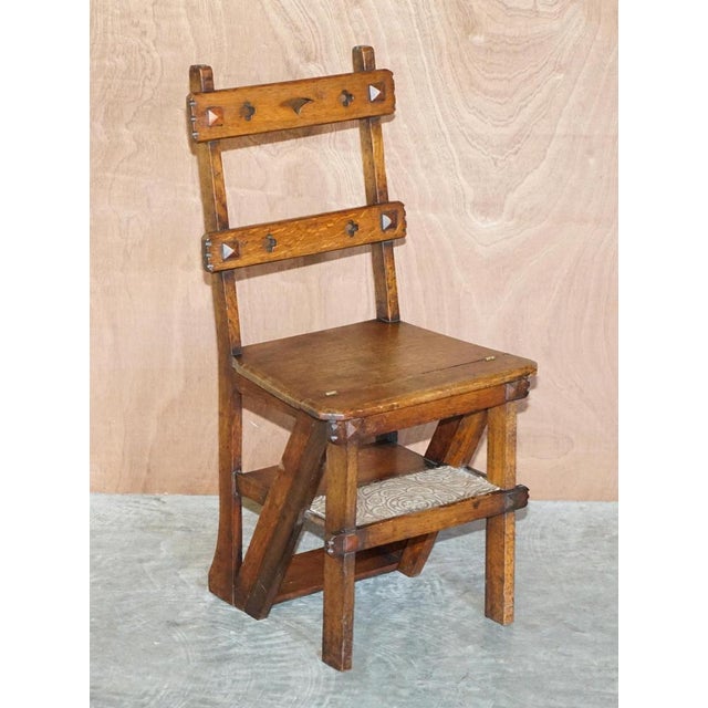 We are delighted to offer for sale this lovely antique Arts & Crafts Victorian metamorphic library steps chair in oak with...