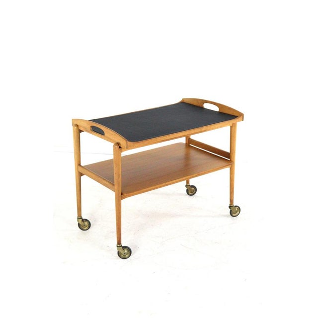 Beautifully designed wooden trolley. This trolley owes its lovely timeless appearance to the flowing lines in the design;...