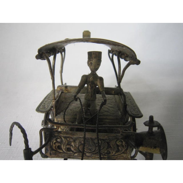 Highly detailed silverplated Djokja Carriage with Horse and Driver. Crafted with intricate Filigree and repousse design....