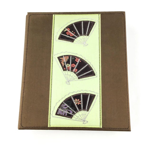 Pure Silk with embroidery and appliqué book for keeping photos or wine labels. Luxury at its best. This silk book is in...