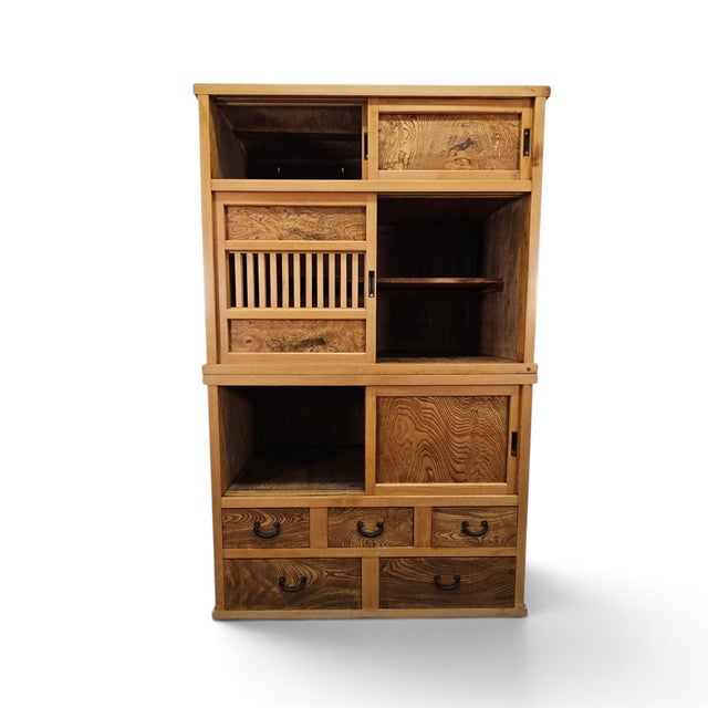 A Japanese two-part Kanto Mizuya Tansu kitchen cupboard dating to the late Meiji–Taisho period, constructed as a...