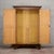 This antique two-door cabinet embodies the authentic charm of vintage furniture, perfect for lovers of historic design and...