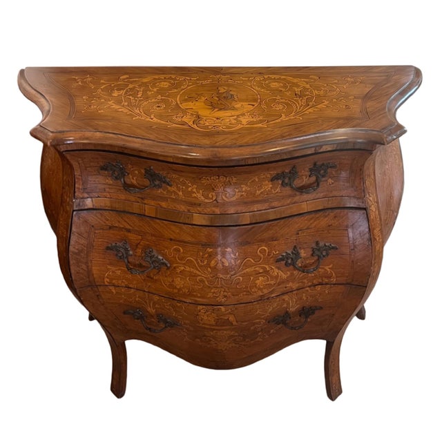 This Dutch bombe commode was made in the 19th century. Beautifully made, marquetry inlaid chest with three good sized...