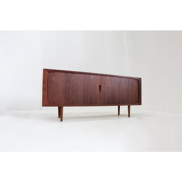 Vintage mid-century sideboard from the 1960s with sliding doors. The sideboard originates from Denmark, dating from the...