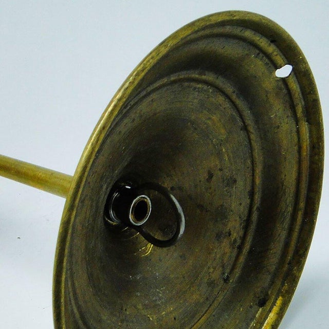 The pendant lamp was produced in the 50s. The construction is brass, glass lampshade. It is preserved in very good...