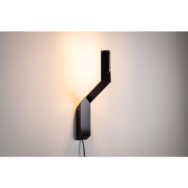 This striking vintage wall lamp by Dijkstra exemplifies mid-century modern design with its distinctive geometric shape and...