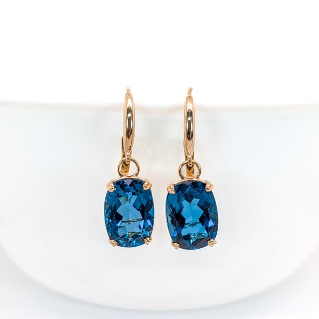 These beautiful lever back earrings feature a pair of 16.45 carat weight oval London Blue Topaz solitaires set in solid...