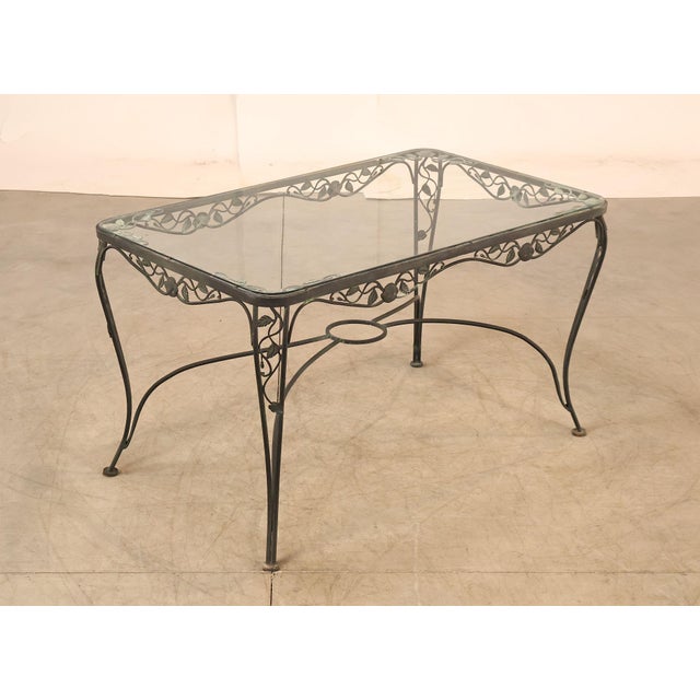 High Quality Glass Top Wrought Iron Patio Table. Table Skirt and Legs Feature leaf & Scroll Pattern. Glass Top Does Not...