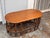 Design Plus Gallery presents a Circa 1970’s Italian Rattan & Wood Coffee Table. This vintage coffee table has an oval wood...