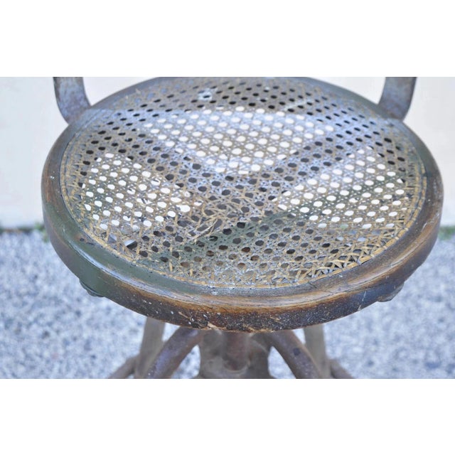 Early 20th Century Antique American Industrial Metal Drafting Work Stool With Oak and Cane Seat For Sale - Image 5 of 10