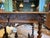 A beautifully carved antique oak table featuring scrolling foliage, barley-twist legs, and a stretcher base. The single...