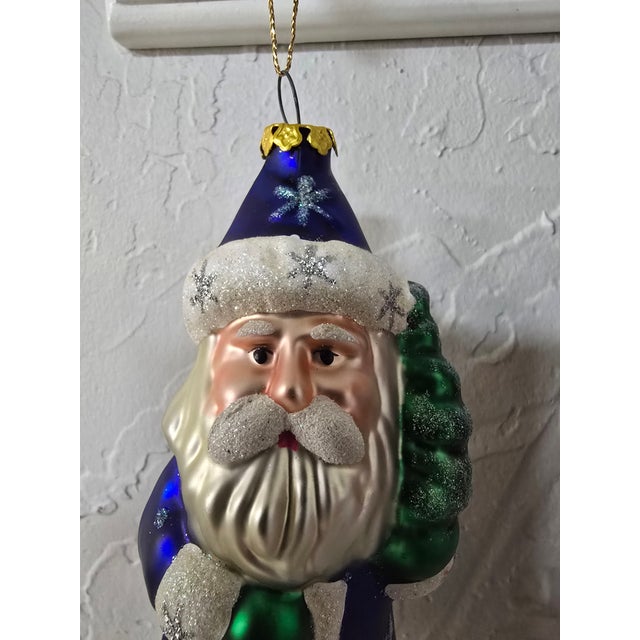 A striking vintage mouth-blown glass Father Christmas ornament reflecting the finest traditions of Polish holiday...