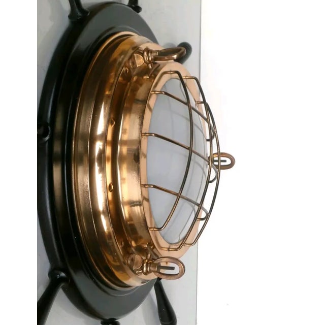 - Helm wall lamp - Designed in Italy in the 1960s - Lacquered wood and glass shade - Brass details European Plug (up to...