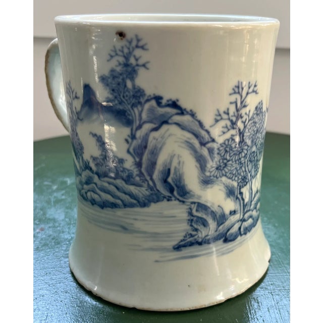Antique 18th century Chinese Kangxi blue and white export porcelain tankard mug decorated with a rocky landscape. Measures...