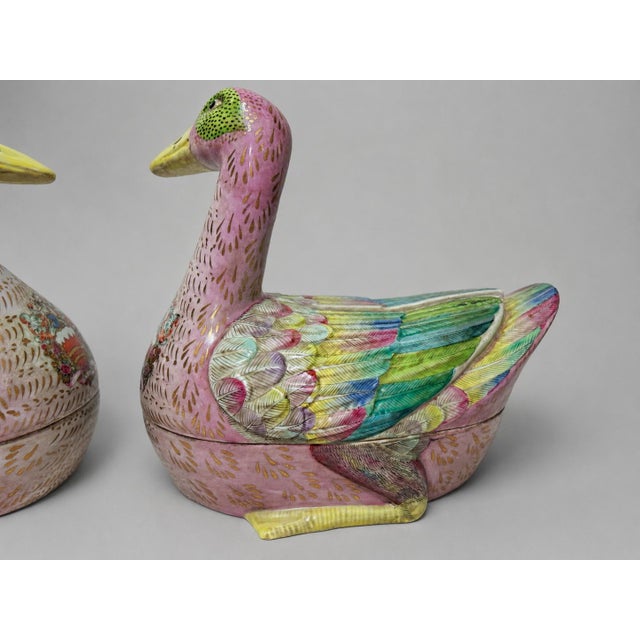 Pair of Chinese Export-Style Famille Rose Armorial Porcelain Duck-Form Covered Tureens A highly decorative pair of export-...