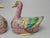 Pair of Chinese Export-Style Famille Rose Armorial Porcelain Duck-Form Covered Tureens A highly decorative pair of export-...