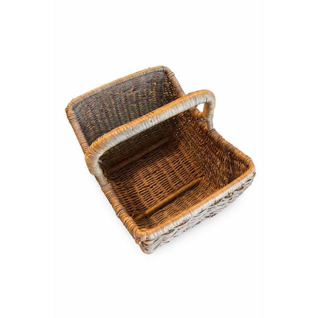 Charming vintage handwoven wicker gathering basket with an authentic mid-century modern vibe and natural texture. The...
