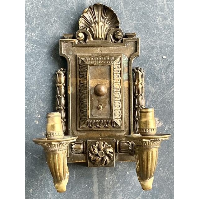 This exquisite vintage Empire-style wall sconce is a masterful display of Neoclassical grandeur. Cast in heavy bronze with...
