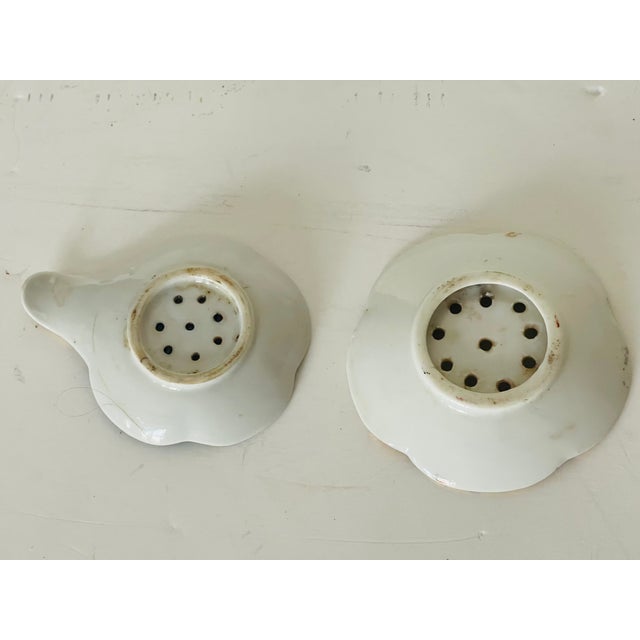 Pair of Antique Polychrome Ceramic Handpainted tea strainers.