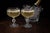 An elegant pair of vintage crystal champagne coupes featuring an elegant etched floral motif, luminous platinum rims, and...