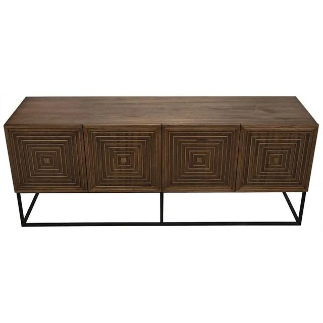 A modern sensibility is paired with intriguing, hand-carved embellishments in this striking sideboard. Each is solid...