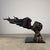 Striking large-scale bronze sculpture depicting two lovers locked in an intimate kiss, rendered in an elegant contemporary...