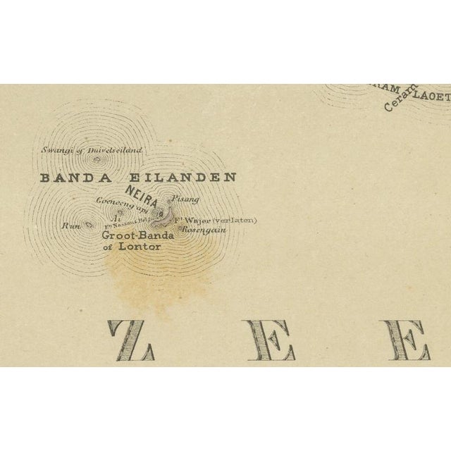 This finely detailed antique map depicts the central moluccan islands, focusing on ceram (seram), buru, ambon, and the...