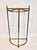 English half moon umbrella stand in brass, having five divisions with decorative finials. This umbrella stand has been...