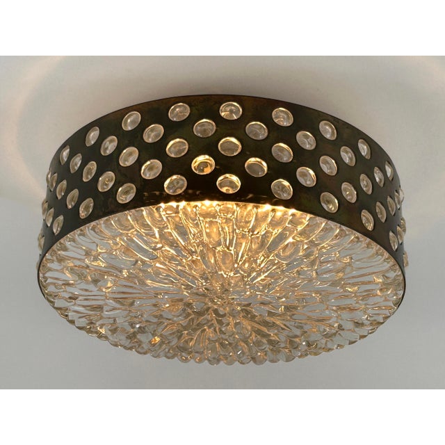 Large, rare, elegant and highly decorative mid-century modern brass and bubble glass ceiling lamp or flush mount. Designed...