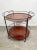 Serving cart tray composed of two removable teak shelves and metal structure painted black which also serves as bottle...