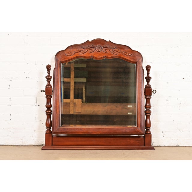 A gorgeous French Provincial or French Country carved solid cherry wood dresser top vanity swing mirror By Thomasville...
