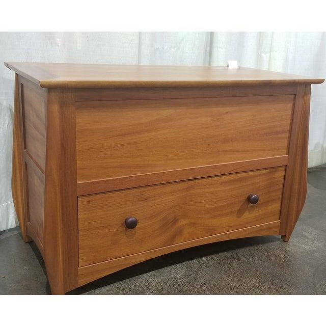 mahogany chest with one soft closing dovetailed drawer the lid is slow closing with aromatic cedar lining