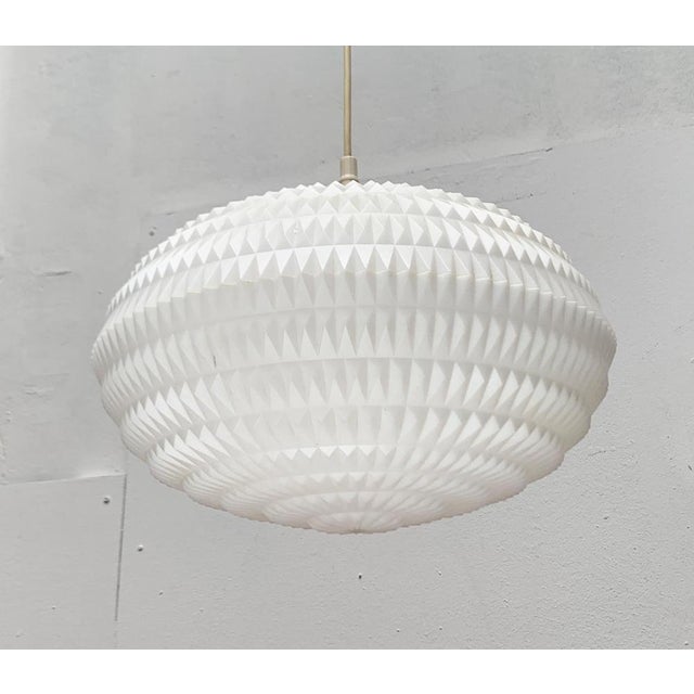 Mid Century pendant light from Erco according to a design by Aloy's gangkofner. A design with a minimalist basic shape and...
