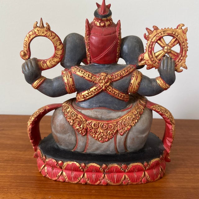 An exceptional, authentic mid-to-late 20th-century Balinese hand-carved wood sculpture depicting the Hindu deity Lord...