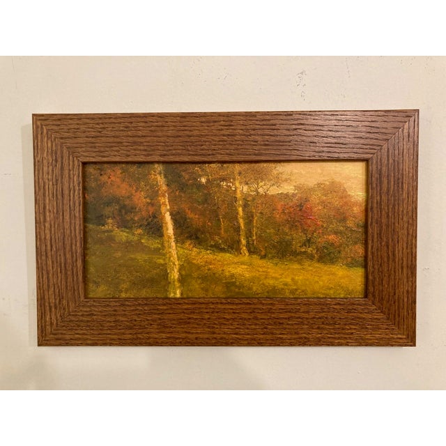 This oil painting captures a serene autumn landscape, where warm hues of orange and gold envelop the scene, evoking a...