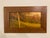 This oil painting captures a serene autumn landscape, where warm hues of orange and gold envelop the scene, evoking a...