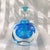 This is a Steven Correia turquoise blue art glass perfume bottle cased in clear glass with a slight gold glitter and the...
