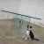 Phenomenal all glass modern dining table attributed to The Pace Collection with only a single brass plated connector on...