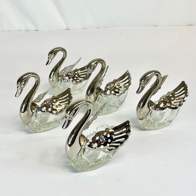 Vintage Home is pleased to offer this set of 5 Swan Salt Cellars. They feature silver plate swan head, long neck and...