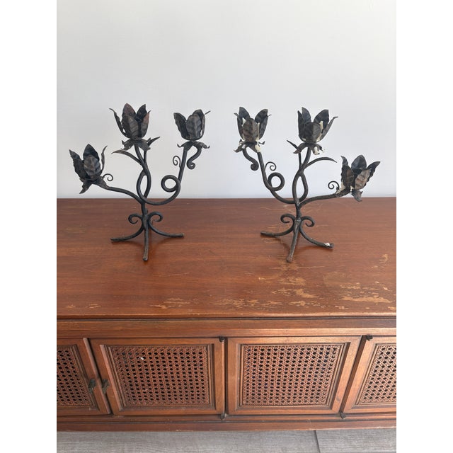 Great OLD pair of Spanish/ Mediterranean style candle holders each piece holds 3 candles , good quality and very ornate feel