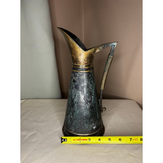 Elevate your collection with this exceptional 1950s Mid-Century Modern solid brass ewer pitcher vase by the renowned...