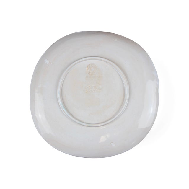 Pablo Picasso (Spanish, 1881-1973), "Tête de chèvre de profil" or "Goat's Head". Partially glazed white earthenware with...