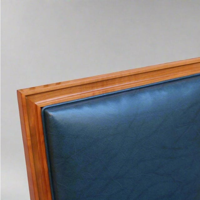 Pair of large De Coene Frères Art Deco Armchairs. Cherrywood with bronze details and sabots. Upholstered in dark blue...