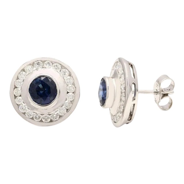 This is part of Chairish’s Fine Jewelry assortment. Round Cut Blue Sapphire Studs with Diamonds in 14K Gold. Embrace your...