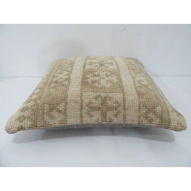 Decorative pillow cover made from a vintage Turkish handknotted rug. Backed with good quality cotton fabric. Pillow...