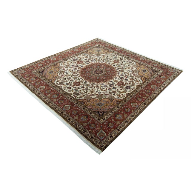 This magnificent Tabriz 50 Raj oriental rug is a true masterpiece of traditional knotting art. with a high knot density of...