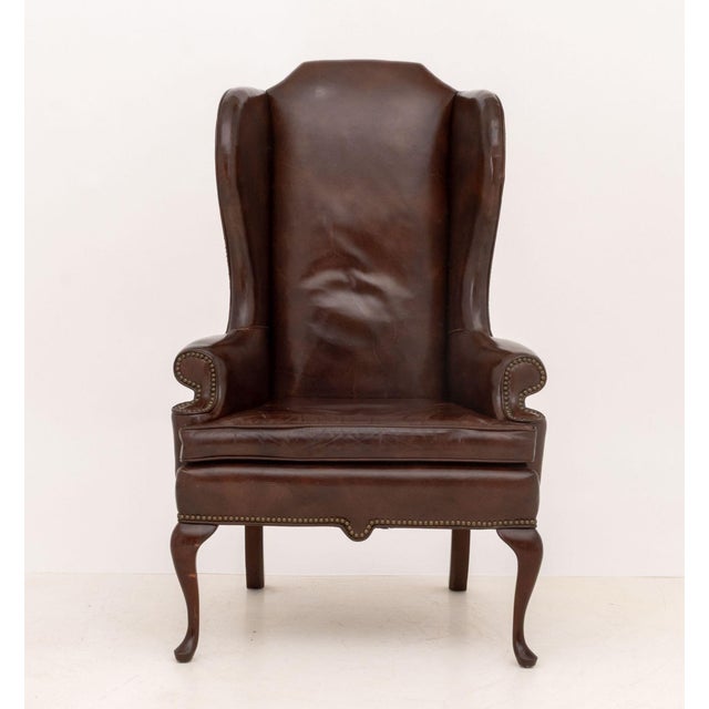 American Queen Anne Style Brass Nailhead Studded Brown Vinyl Upholstered Wingback Arm Chair, atop walnut cabriole legs,...