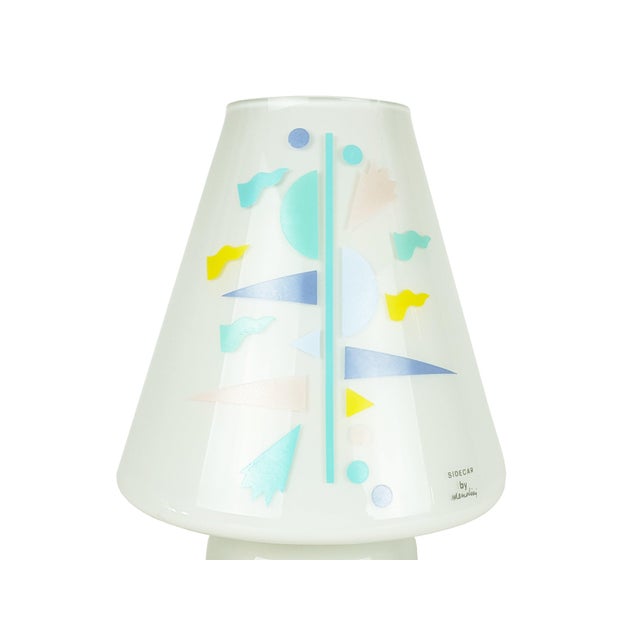 Light grey glass shade with multicolored geometrical decoration. the lamp remains in brand new condition with its original...