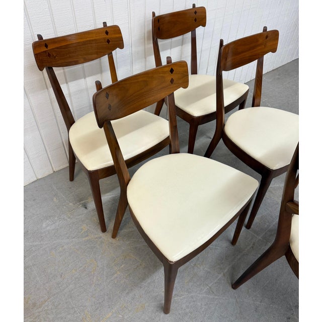 This listing is for a set of five Mid-Century Modern Drexel Declaration Walnut Dining Chairs. Featuring one arm chair,...