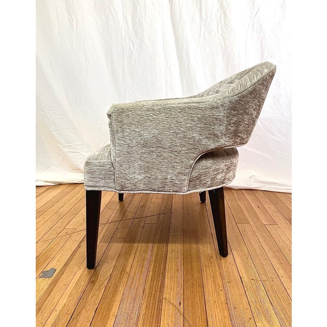 Kravet Alexander chair designed by Michael Berman, featuring a refined and sculptural silhouette with softly curved arms...